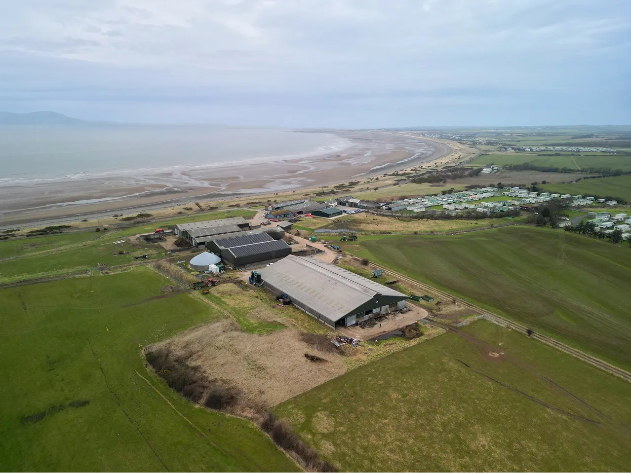Aerial view of Blue Dial Farm, showing grazing paddocks and farm buildings.